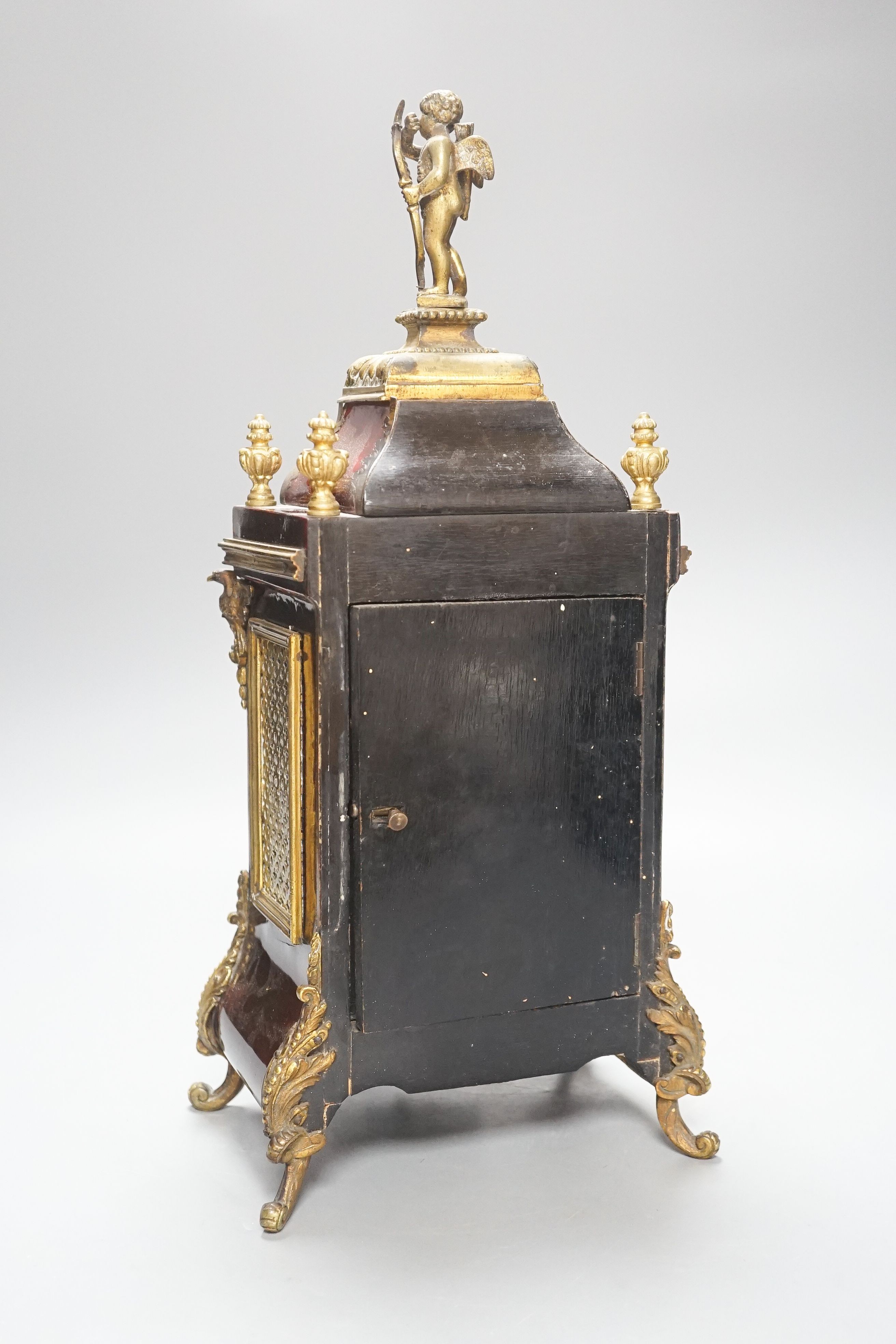 A 19th century French tortoiseshell and gilt metal mounted clock with key and pendulum 40cm